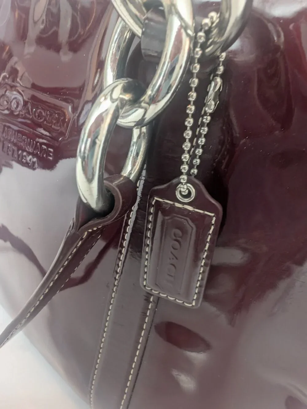 Coach Plum/Burgundy patent leather handbag